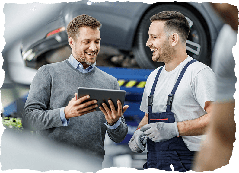 Happy customer and auto mechanic using touchpad in a workshop