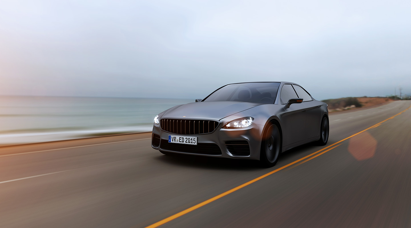 Car driving on a road by sea